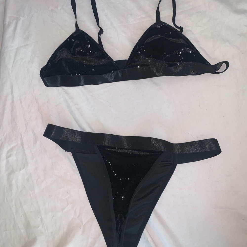 Black velvet two piece with silver stars and sparkle ascents. Just like new.